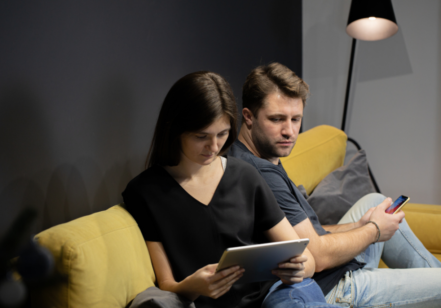 man and woman sitting on sofa  insecure man