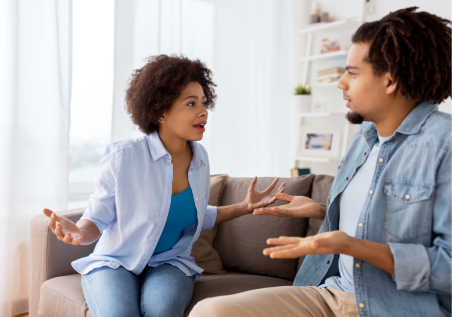 couple talking on sofa  Falling Out of Love After Infidelity