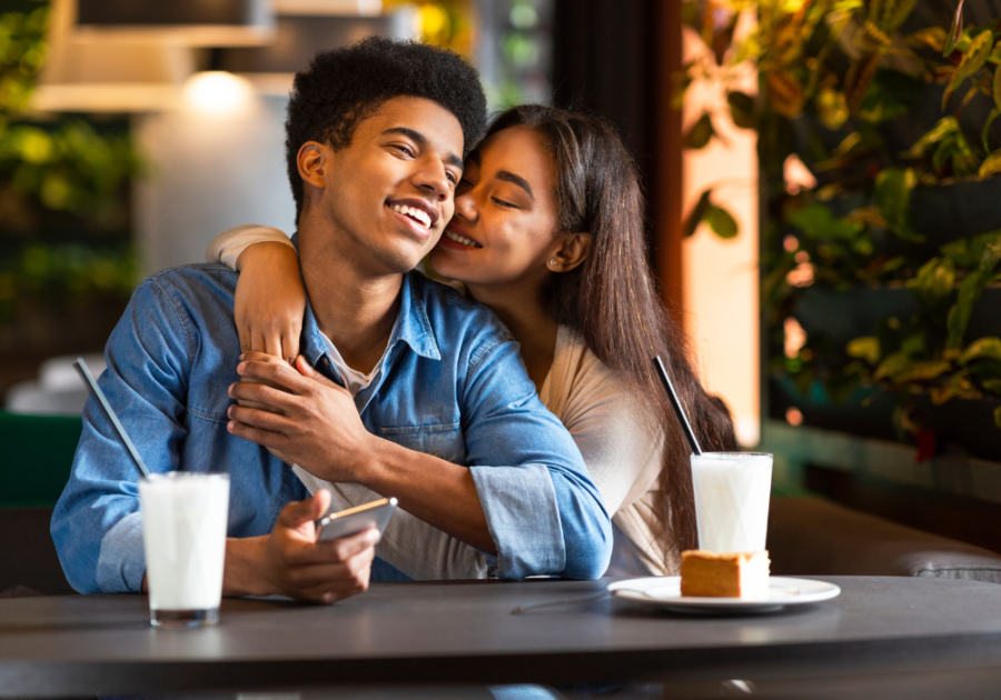 woman hugging man at table 3 Words to Make a Woman Want You