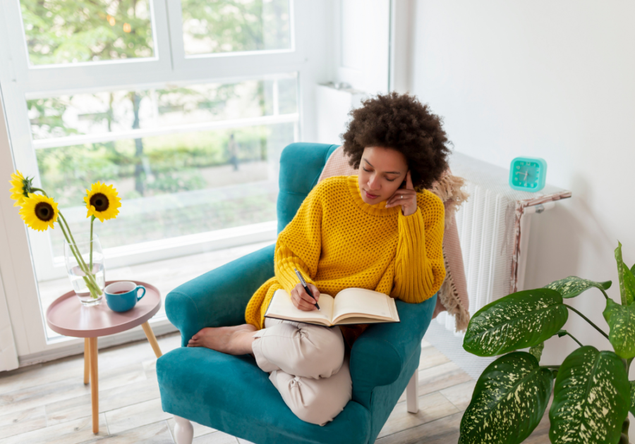 woman sitting in chair writing Missing You Poems