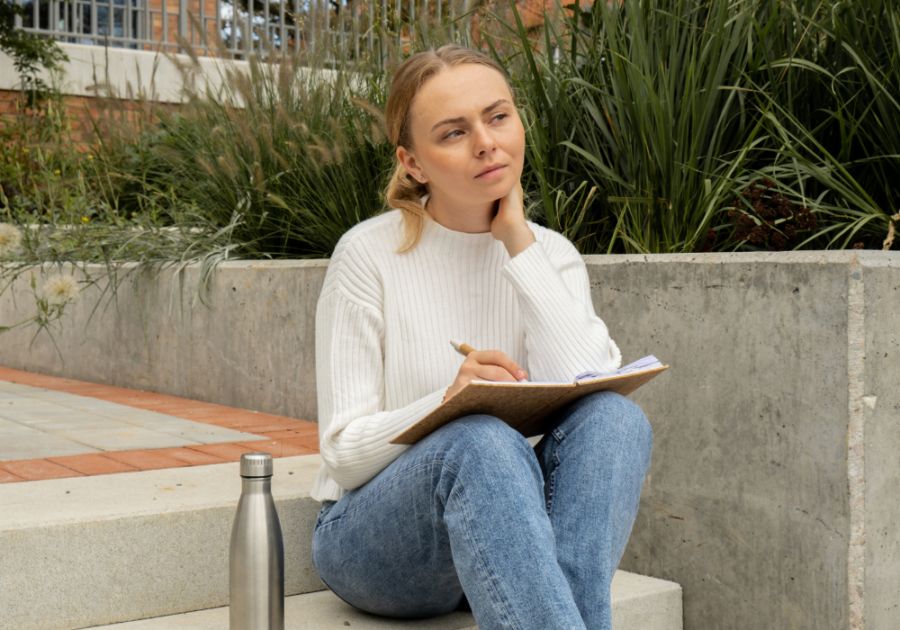 woman sitting on steps writing  Love Poems For Crush