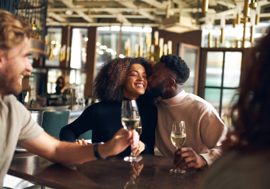 couple laughing at bar Aquarius and Virgo Compatibility