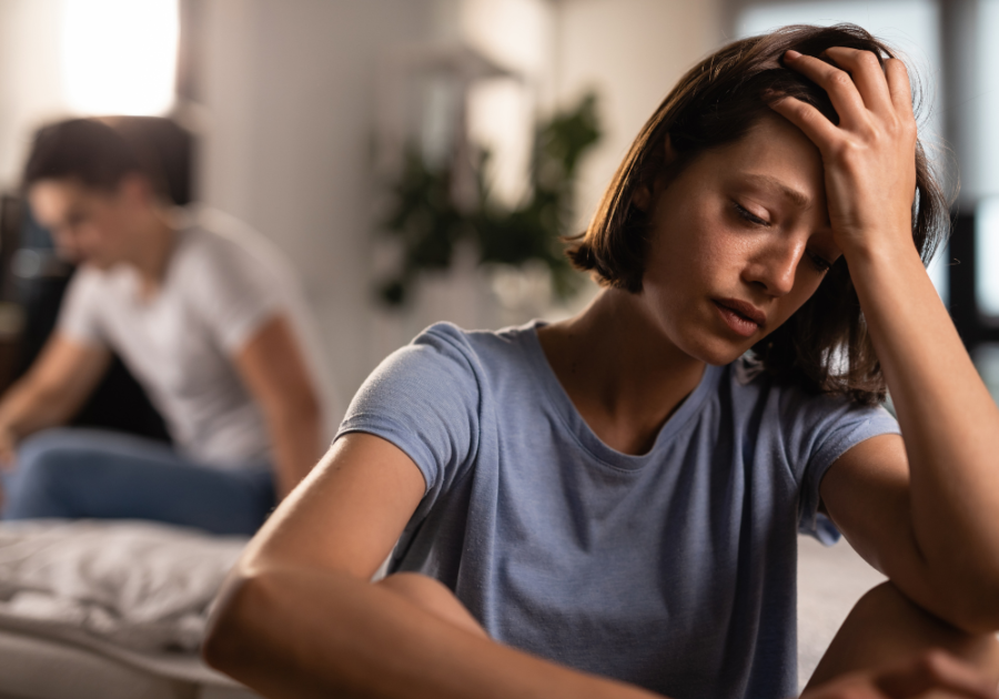 woman sad with man sitting behind My Ex Moved on Like I Was Nothing