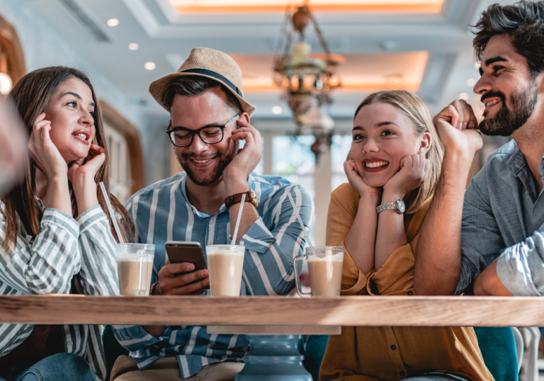 group sitting at coffee shop hot seat questions