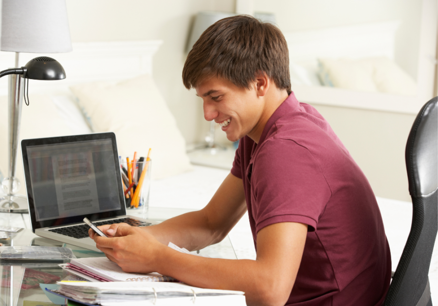 young man sitting at desk dating apps for teenagers