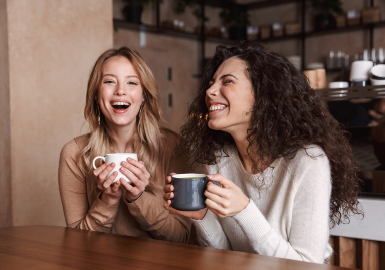 women laughing having coffee Best Favorite Things Questions