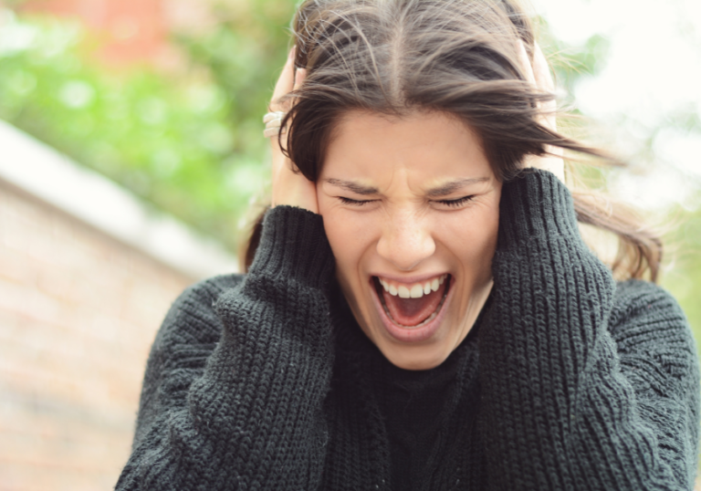 woman holding her head and screaming Why Do I Hate People