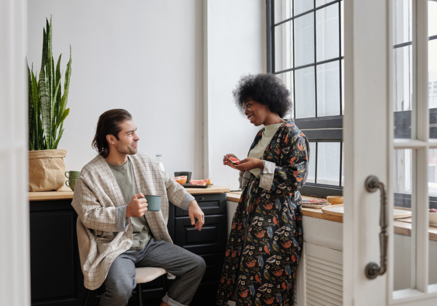 couple sitting by window When a Guy Tells You Personal Things About Himself