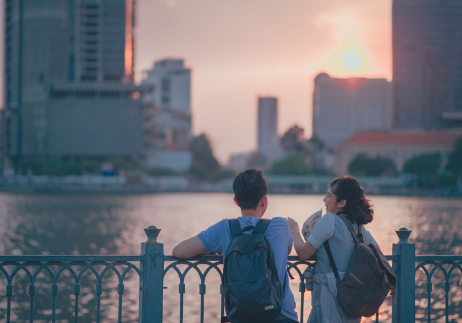 couple standing by harbor looking at cityscape When a Guy Tells You Personal Things About Himself