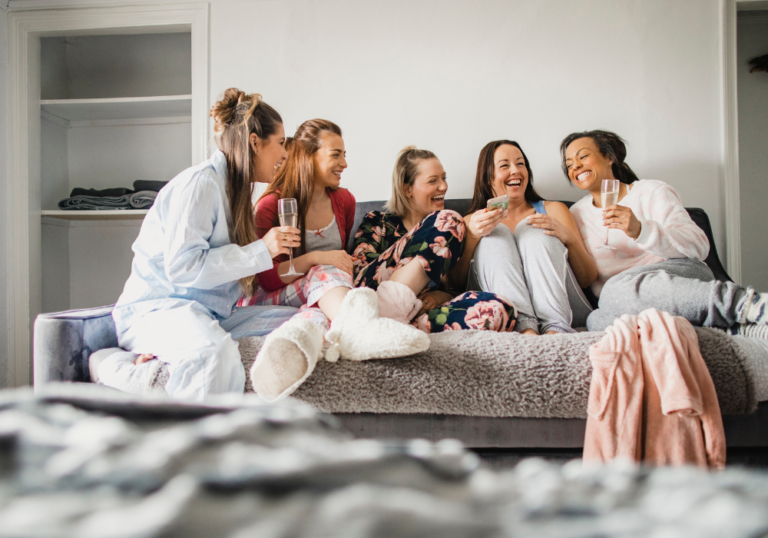 group of women sitting on sofa girls night questions