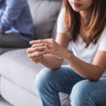 woman and man sitting apart on sofa when is enough enough